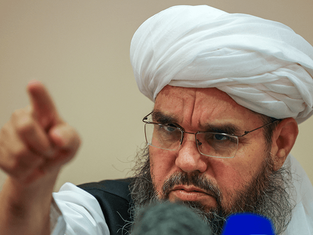 Taliban negotiator Shahabuddin Delawar points as he attends a press conference in Moscow on July 9, 2021. - Russia on July 9, 2021 said the Taliban controls about two-thirds of the Afghan-Tajik border and urged all sides in Afghanistan to show restraint. (Photo by Dimitar DILKOFF / AFP) (Photo by …