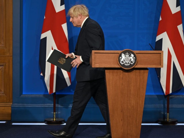 LONDON, ENGLAND - JULY 12: Britain's Prime Minister Boris Johnson leaves after giving an update on relaxing restrictions imposed on the country during the coronavirus covid-19 pandemic at a virtual press conference inside the Downing Street Briefing Room on July 12, 2021 in London, England.