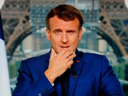French President Emmanuel Macron is seen on a TV screen as he speaks during a televised address to the nation from the temporary Grand Palais in Paris on July 12, 2021. (Photo by Ludovic MARIN / AFP) (Photo by LUDOVIC MARIN/AFP via Getty Images)