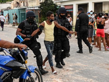 A man is arrested during a demonstration against the government of President Miguel Diaz-Canel in Arroyo Naranjo Municipality, Havana on July 12, 2021. - Cuba on Monday blamed a "policy of economic suffocation" of United States for unprecedented anti-government protests, as President Joe Biden backed calls to end "decades of …