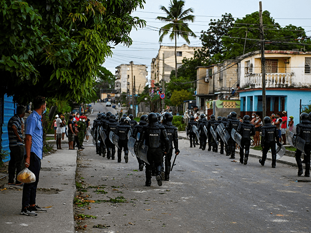 Riot police walk the streets after a demonstration against the government of President Miguel Diaz-Canel in Arroyo Naranjo Municipality, Havana on July 12, 2021. - Cuba on Monday blamed a "policy of economic suffocation" of United States for unprecedented anti-government protests, as President Joe Biden backed calls to end "decades of repression" on the communist island. Thousands of Cubans participated in Sunday's demonstrations, chanting "Down with the dictatorship," as President Miguel Díaz-Canel urged supporters to confront the protesters. (Photo by YAMIL LAGE / AFP) (Photo by YAMIL LAGE/AFP via Getty Images)