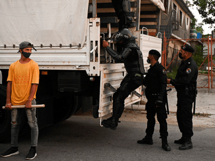 Riot police officers get on the trucks after a demonstration against the government of President Miguel Diaz-Canel in Arroyo Naranjo Municipality, Havana on July 12, 2021. - Cuba on Monday blamed a "policy of economic suffocation" of United States for unprecedented anti-government protests, as President Joe Biden backed calls to …