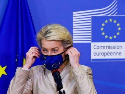 European Commission President Ursula von der Leyen removes her protective face mask as she welcomes the Austrian President in Brussels, on July 13, 2021. (Photo by PASCAL ROSSIGNOL / POOL / AFP) (Photo by PASCAL ROSSIGNOL/POOL/AFP via Getty Images)