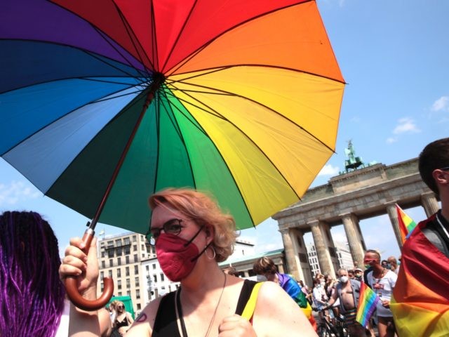 BERLIN, GERMANY - JULY 24: Participants take part in the annual Christopher Street Day parade on July 24, 2021 in Berlin, Germany. The Christopher Street Day parade is held in memory of the first big uprising of the gay community against police assaults in New York's Greenwich Village in June, …