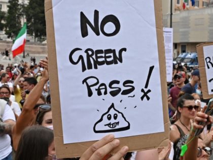 Protestors take part in a demonstration against the introduction of a mandatory "green pass" in the aim to limit the spread of the Covid-19, called by far right Forza Nuova party activists and "Io Apro (I open up) group of restaurant owners and workers, entrepreneurs and small businesses owners on …