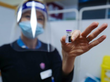 TRURO, ENGLAND - DECEMBER 09: A staff nurse at the Royal Cornwall Hospital prepares to adm