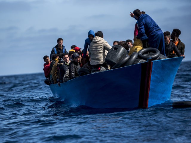 AT SEA - MARCH 29: Migrants of different nationalities aboard a wooden boat before being rescued by the NGO Open Arms on March 29, 2021 in At Sea, Unspecified. The Spanish NGO Open Arms rescued passengers in two wooden boats, with 84 and 97 people respectively. The Open Arms vessel …