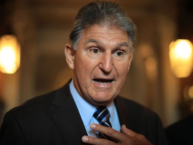 WASHINGTON, DC - MAY 28: Sen. Joe Manchin (D-WV) talks with reporters after stepping off the Senate Floor at the U.S. Capitol on May 28, 2021 in Washington, DC. The Senate decided to postpone debate on the act after a small group of Republicans filibustered the bill overnight. The Senate …
