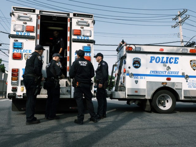 NEW YORK, NEW YORK - JULY 08: Police gather at a crime scene following a stand-off in fron