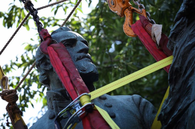 CHARLOTTESVILLE, VIRGINIA - JULY 10: Workers remove a statue of Confederate General Thoma