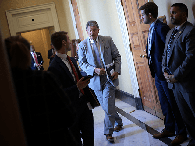 Sen. Joe Manchin (D-WV) leaves the weekly Democratic policy luncheon at the U.S. Capitol o