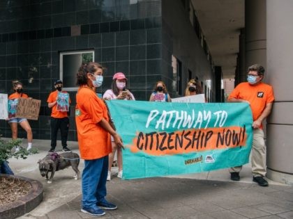 HOUSTON, TEXAS - JULY 19: Members of the United We Dream organization participate in a demonstration outside of the U.S. District Courthouse on July 19, 2021 in Houston, Texas. The demonstration was a call for a clear path to citizenship and was held in response to Texas District Judge Andrew …