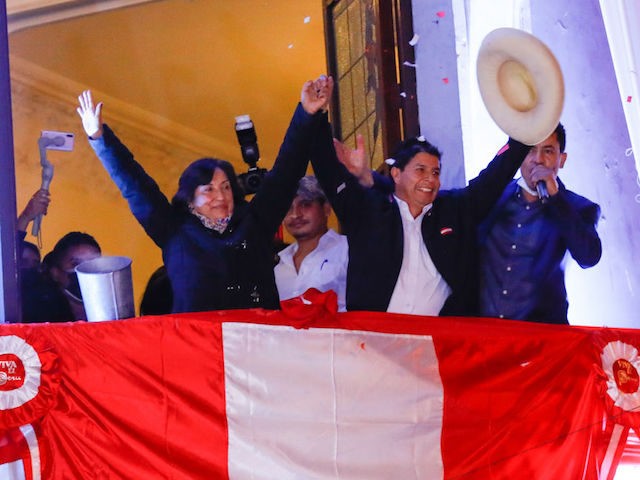 LIMA, PERU - JULY 19: Newly Elected President of Peru Pedro Castillo waves supporters with his running mate Dina Boluarte during a celebration after being confirmed as new president of Peru at the campaign headquarters on July 19, 2021 in Lima, Peru. 43 days after the presidential runoff, officials announced …
