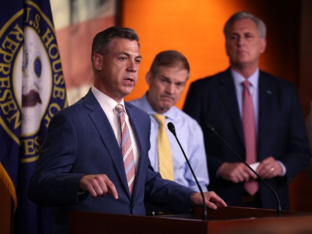WASHINGTON, DC - JULY 21: Rep. Jim Banks (R-IN) (L), joined by Rep. Jim Jordan (R-ON) (C) and House Minority Leader Kevin McCarthy (R-CA) speaks at a news conference on House Speaker Nancy Pelosi’s decision to reject two of Leader McCarthy’s selected members from serving on the committee investigating the …