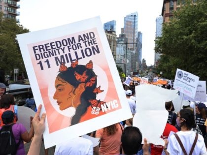 NEW YORK, NEW YORK - JULY 23: People participate in a march in support of a pathway to citizenship for immigrants on July 23, 2021 in New York City. Various organizations, elected officials and immigrant essential works gathered for a national day of action demanding a pathway to citizenship to …