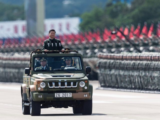 China's President Xi Jinping inspects People's Liberation Army soldiers at a barracks in Hong Kong on June 30, 2017. - Xi tours a garrison of Hong Kong's People's Liberation Army garrison as part of a landmark visit to the politically divided city. (Photo by DALE DE LA REY / AFP) …
