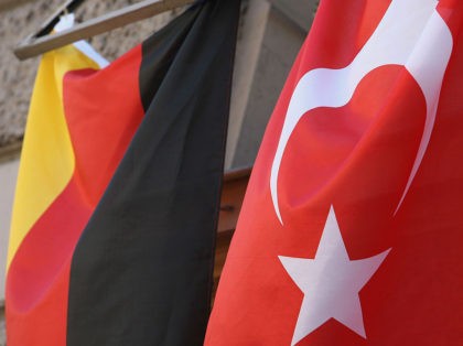 WIESBADEN, GERMANY - JUNE 23: A German and a Turkish flag hang from windows on an apartme