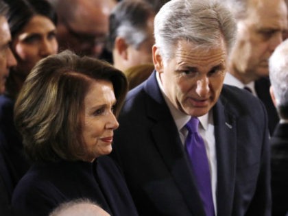 WASHINGTON, DC - FEBRUARY 28: (AFP-OUT) House Majority Leader Kevin McCarthy (R-CA) speaks with Minority Leader Nancy Pelosi (D-CA) as they wait for the start of ceremonies as the late evangelist Billy Graham lies in repose at the U.S. Capitol, on February 28, 2018 in Washington, DC. Rev. Graham is …