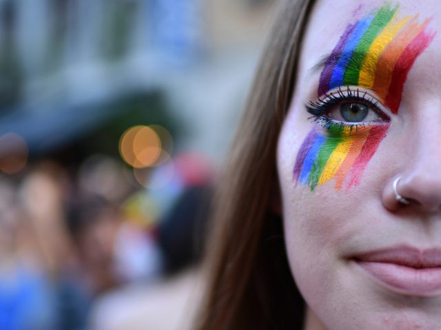 A woman takes part in the annual Lesbian, Gay, Bisexual and Transgender (LGBT) Pride Parade in Milan, on June 30, 2015. (Photo by MIGUEL MEDINA / AFP) (Photo credit should read MIGUEL MEDINA/AFP via Getty Images)