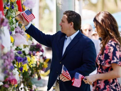 SURFSIDE, FLORIDA - JULY 03: Florida Gov. Ron DeSantis and his wife, Casey, visit a memorial to those missing outside the 12-story Champlain Towers South condo building that partially collapsed on July 03, 2021 in Surfside, Florida. Over one hundred people are being reported as missing as the search-and-rescue effort …