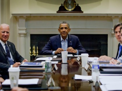 President Barack Obama, center, and Vice President Joe Biden, left, meet with members of the National Security Council, Monday, Aug. 18, 2014, in the Roosevelt Room of the White House in Washington. Also at the meeting are Deputy National Security Adviser Tony Blinken, and Homeland Security Advisor Lisa Monaco, far …