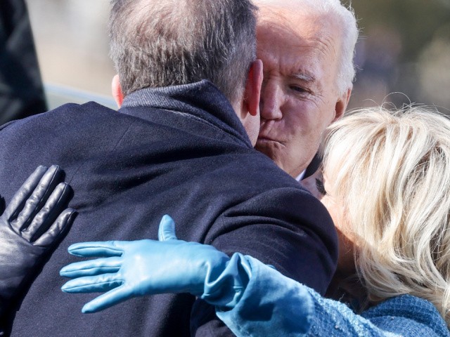 Ashley Biden (L), Hunter Biden (2nd L) and Jill Biden (R) hug US President Joe Biden after being sworn in during his inauguration as the 46th President of the United States, on the West Front of the US Capitol in Washington, DC on January 20, 2021. (Photo by JONATHAN ERNST / POOL / AFP) (Photo by JONATHAN ERNST/POOL/AFP via Getty Images)
