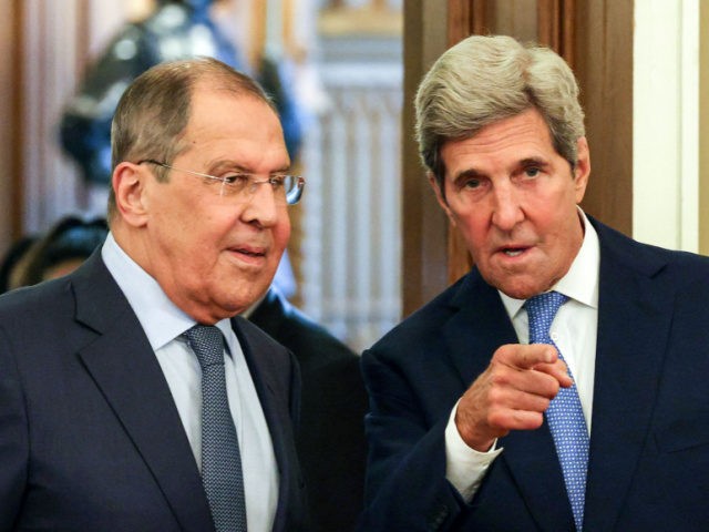 Russian Foreign Minister Sergei Lavrov (L) welcomes US climate envoy John Kerry (R) for a meeting in Moscow on July 12, 2021. (Photo by Dimitar DILKOFF / POOL / AFP) (Photo by DIMITAR DILKOFF/POOL/AFP via Getty Images)