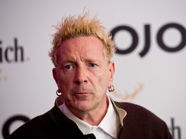 LONDON, ENGLAND - JULY 21: John Lydon poses in front of the winners boards after accepting the Outstanding Contribution to Music Award for PiLat the Glenfiddich Mojo Honours List 2011 at The Brewery on July 21, 2011 in London, England. (Photo by Ian Gavan/Getty Images)