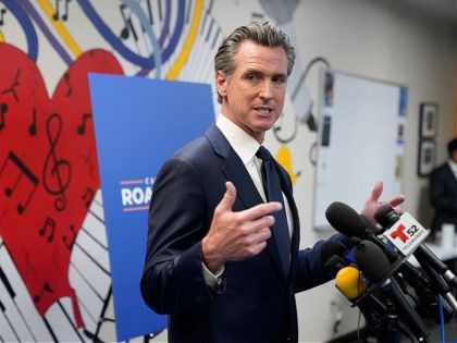 California Gov. Gavin Newsom fields questions after a rally where he signed the California