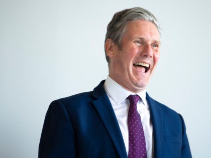 BRISTOL, ENGLAND - MAY 27: Leader of the Labour Party Keir Starmer laughs during a visit to the SGS WISE Campus on May 27, 2021 in Bristol, England. The West of England's new metro mayor Dan Norris was elected in May's elections and is being joined on a jobs visit …