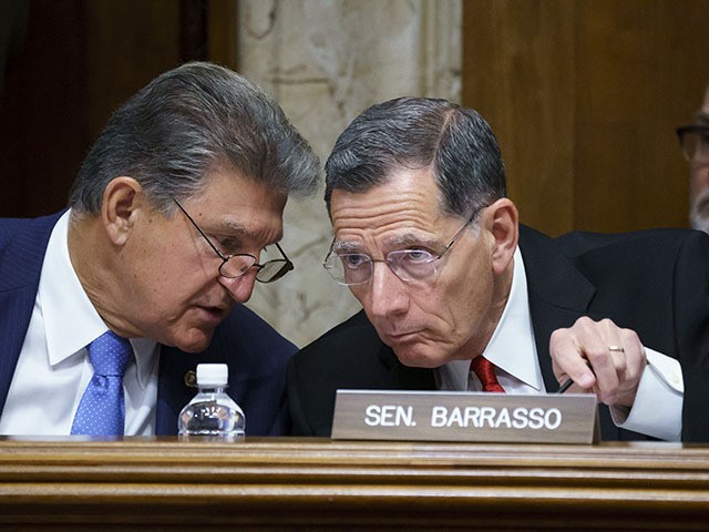 In this June 23, 2021, file photo, Sen. Joe Manchin (D-WV), chair of the Senate Energy and Natural Resources Committee, holds a hearing with ranking member Sen. John Barrasso (R-WY) at the Capitol in Washington. (AP Photo/J. Scott Applewhite)