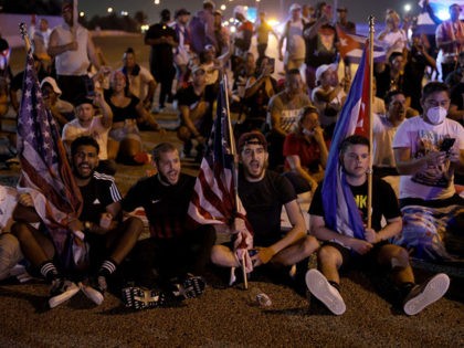 MIAMI, FLORIDA - JULY 13: Protesters shut down part of the Palmetto Expressway as they show their support for the people in Cuba that have taken to the streets to protest on July 13, 2021 in Miami, Florida. On Sunday, thousands of Cubans took to the streets across the country …