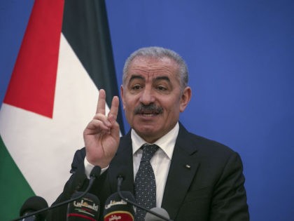 Palestinian Prime Minister Mohammad Shtayyeh gestures as he talks to reporters during a press conference in Ramallah on May 5, 2020, about the decision announced a day earlier to renew the state of emergency in Palestinian-ruled areas of the occupied West Bank. - The Palestinian Authority renewed the coronavirus lockdown …