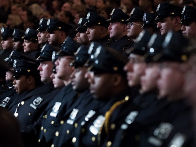The newest members of the New York City Police Department (NYPD) listen to remarks from New York City Police Commissioner James O'Neill during their police academy graduation ceremony at the Theater at Madison Square Garden, March 30, 2017 in New York City. Over 600 new officers were sworn in during …