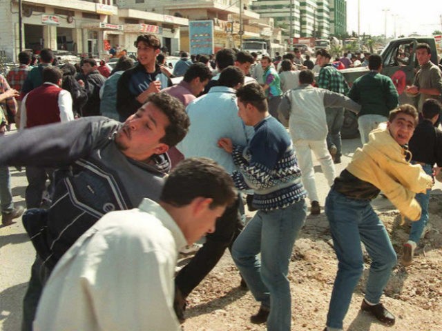 Palestinian Youths Throw Rocks at Israelis