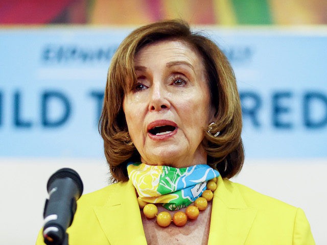 LOS ANGELES, CALIFORNIA - JULY 15: House Speaker Nancy Pelosi (D-CA), C, speaks as Rep. Jimmy Gomez (D-CA) looks on at a press conference on the newly expanded Child Tax Credit at the Barrio Action Youth and Family Center on July 15, 2021 in Los Angeles, California. Many Americans with …