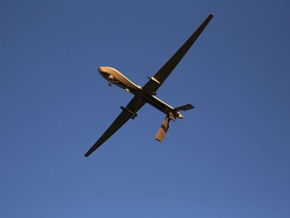 UNSPECIFIED, UNSPECIFIED - JANUARY 07: A U.S. Air Force MQ-1B Predator unmanned aerial vehicle (UAV), carrying a Hellfire missile flies over an air base after flying a mission in the Persian Gulf region on January 7, 2016. The U.S. military and coalition forces use the base, located in an undisclosed …