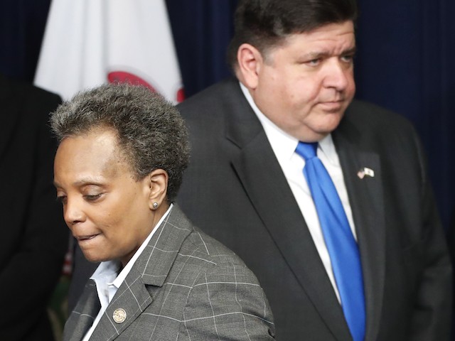 Migrants - Illinois Gov. J.B. Pritzker, right, and Chicago mayor Lori Lightfoot participate in a news conference where the governor announced a shelter in place order to combat the spread of the COVID-19 virus, Friday, March 20, 2020, in Chicago. (AP Photo/Charles Rex Arbogast)