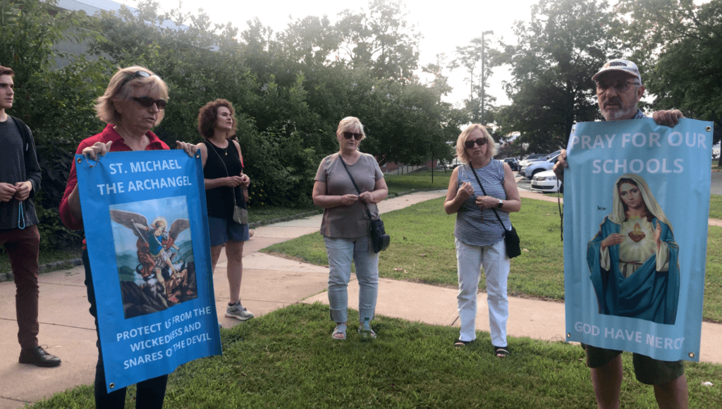 Pray for Our Schools gathers to pray the rosary before a Fairfax County Public School Board meeting on July 15, 2021. (Madeleine Hubbard/Breitbart News)