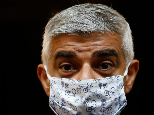 LONDON, ENGLAND - JUNE 27: London Mayor Sadiq Khan looks on as he wears a face mask during a visit to Borough Market on June 27, 2021 in London, England. Khan visited London's Borough Market as it opened to the public on Sundays for the first time in recent history. …