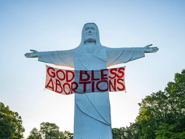 God Bless Abortions banner in Arkansas (indeclineofficial/Instagram)