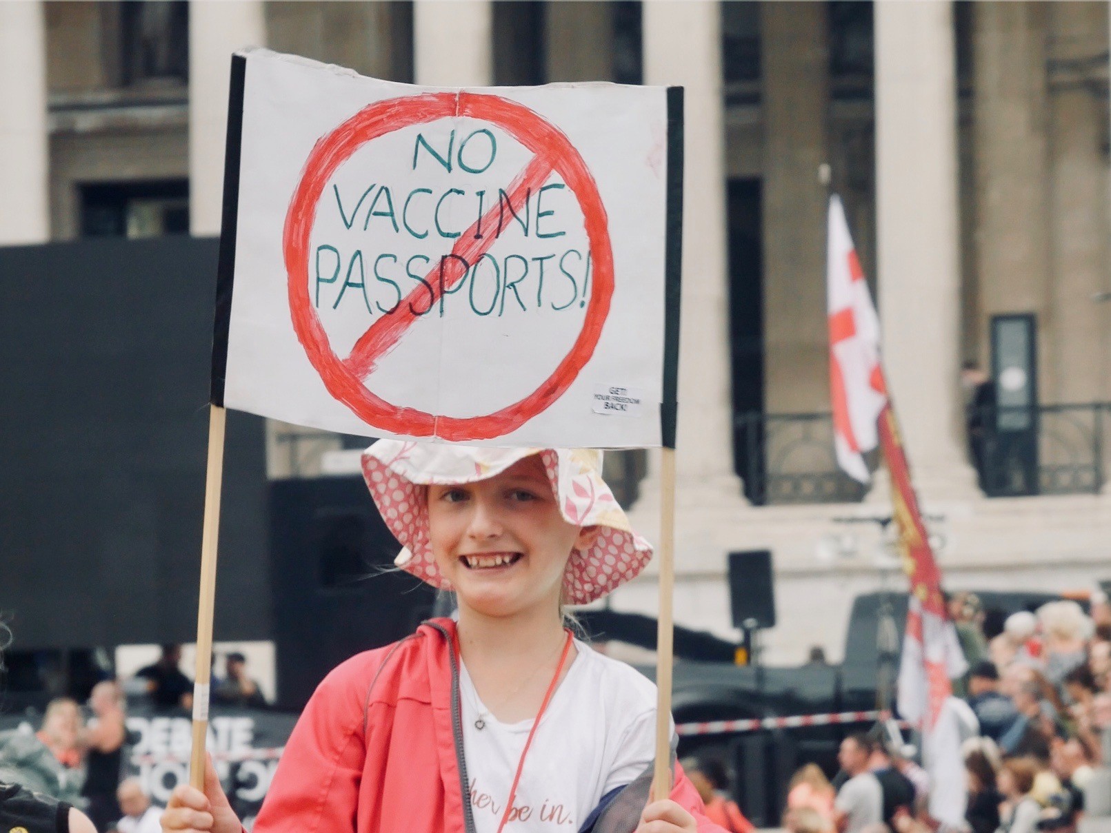 A child holds a placard reading "No Vaccine Passports" at the Freedom Rally in London's Trafalgar Square, July 24th, 2021. Kurt Zindulka, Breitbart News