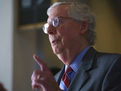 Senate Minority Leader Mitch McConnell, R-Ky., speaks to a reporter following a cable news