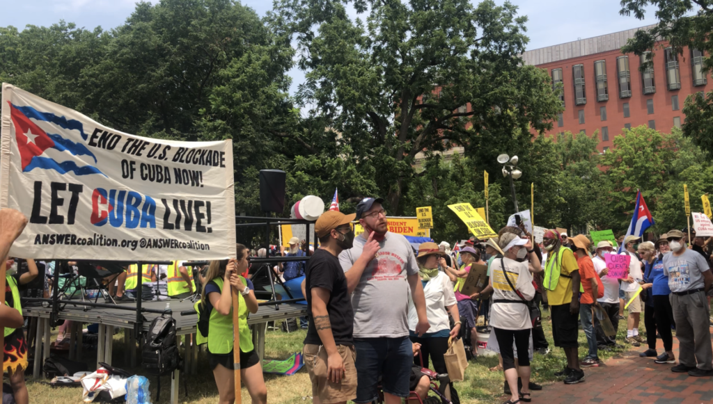 Protesters with the ANSWER Coalition demand an end to the U.S. blockade of Cuba on Sunday, July 25, 2021 in front of the White House. (Madeleine Hubbard/Breitbart News)