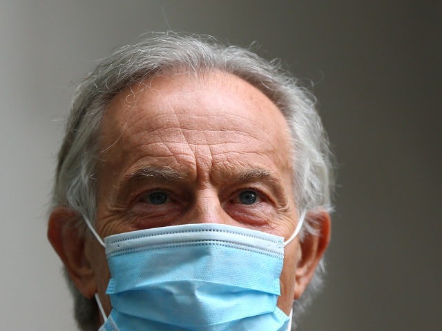 LONDON, ENGLAND - JUNE 06: Former British Prime Minister Tony Blair wears a mask as he lea