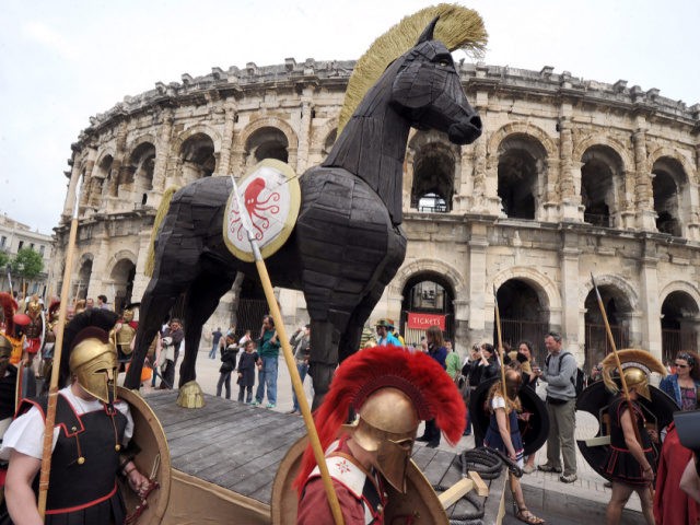 TO GO WITH AFP STORY BY REMY ZAKA - People parade with a Trojan horse during an historical reenactment in front of the amphitheatre as part of the third edition of the Roman Games on April 28, 2012 in Nimes, southern France. The event, that focused this year on the …