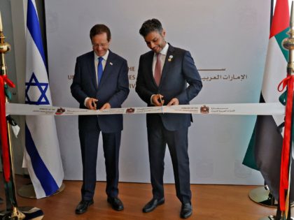 Israeli President Isaac Herzog (L) and Emirati Ambassador to Israel Mohamed al-Khaja cut the ribbon at the new UAE embassy in Tel Aviv on July 14, 2021. - The United Arab Emirates opened its embassy in Israel, housed in Tel Aviv's new stock exchange building, in the latest step solidifying …