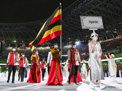 TOKYO, JAPAN - JULY 23: Flag bearers Kirabo Namutebi and Shadiri Bwogi of Team Uganda during the Opening Ceremony of the Tokyo 2020 Olympic Games at Olympic Stadium on July 23, 2021 in Tokyo, Japan. (Photo by Matthias Hangst/Getty Images)