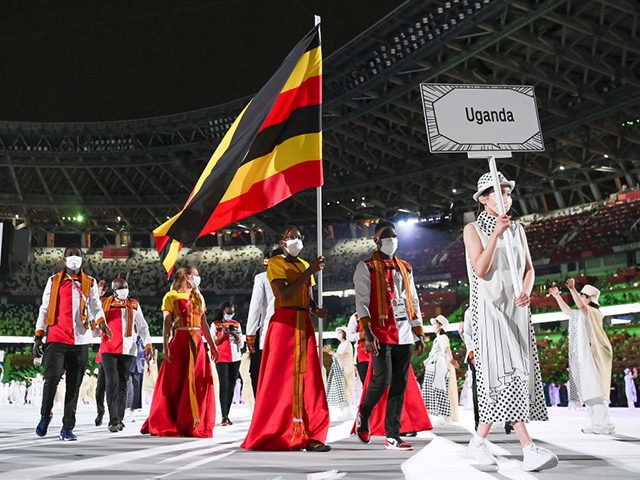 TOKYO, JAPAN - JULY 23: Flag bearers Kirabo Namutebi and Shadiri Bwogi of Team Uganda duri