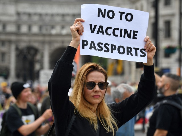 A protestor displays an anti-vax placard during a 'Unite For Freedom' march against Covid-19 vaccinations and government lockdown restrictions, in Trafalgar Square, central London on May 29, 2021. (Photo by Ben STANSALL / AFP) (Photo by BEN STANSALL/AFP via Getty Images)
